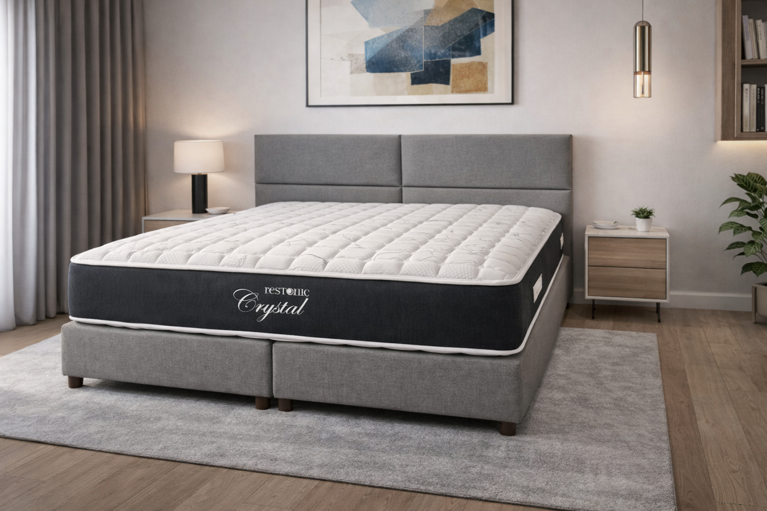 A Restonic Crystal mattress on a bed in a bedroom setting.