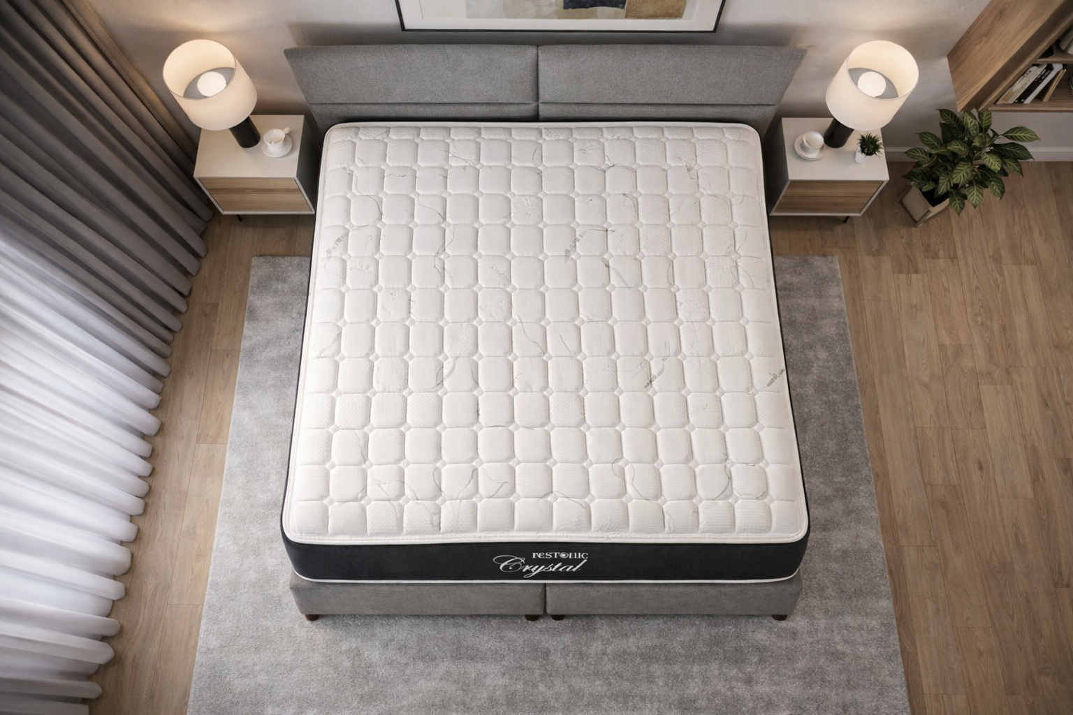 A Restonic Crystal mattress on a bed in a bedroom setting with nightstands and lamps.