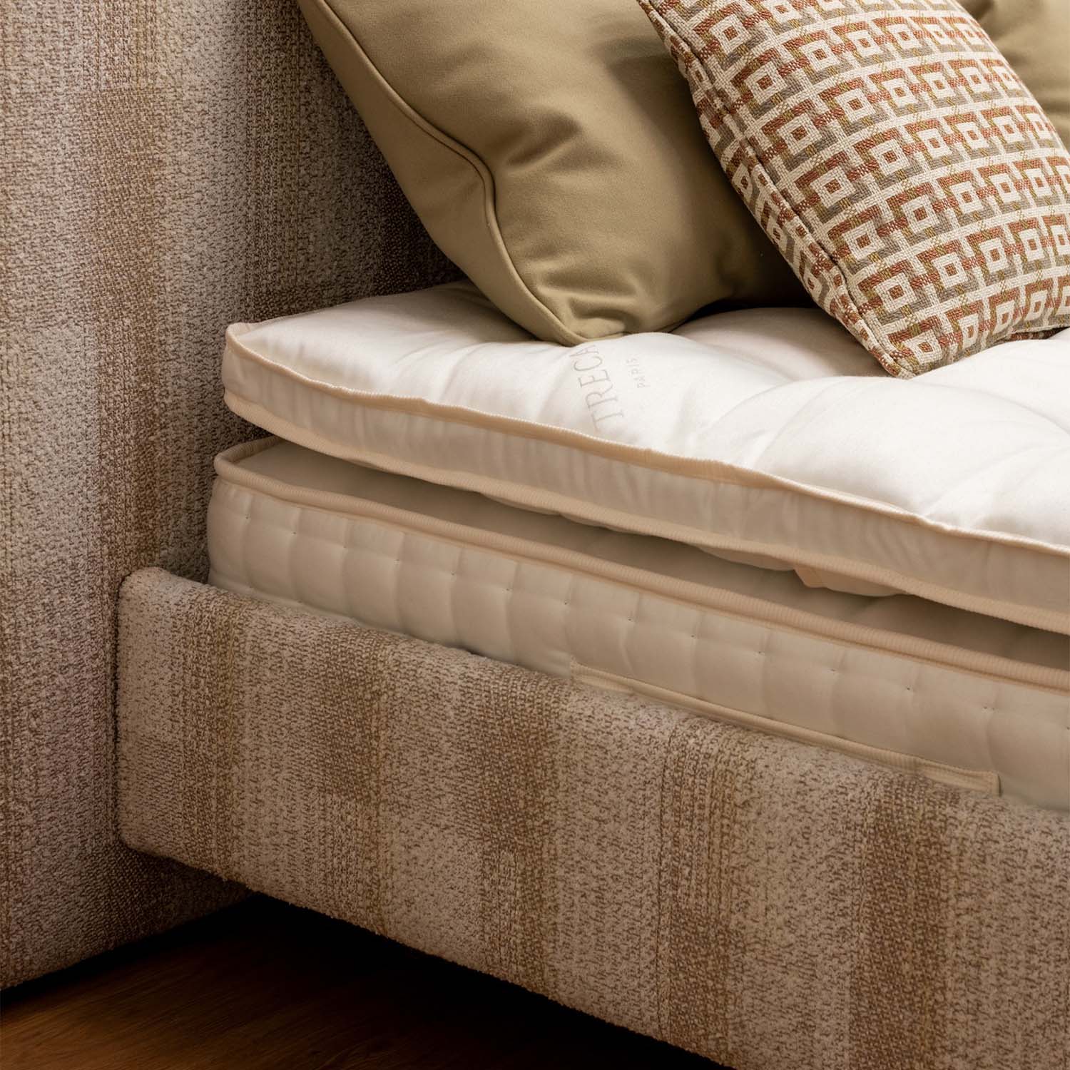 Close-up of a Treca miniflex bed base with cushions in a bedroom setting