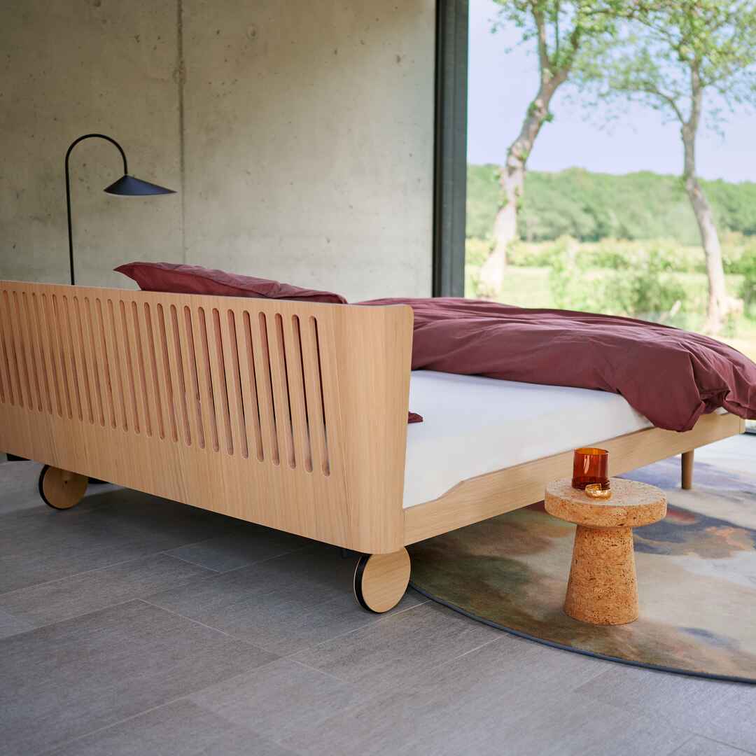 Noa with Back Wheels and Milled Headboard in Balanced Oak